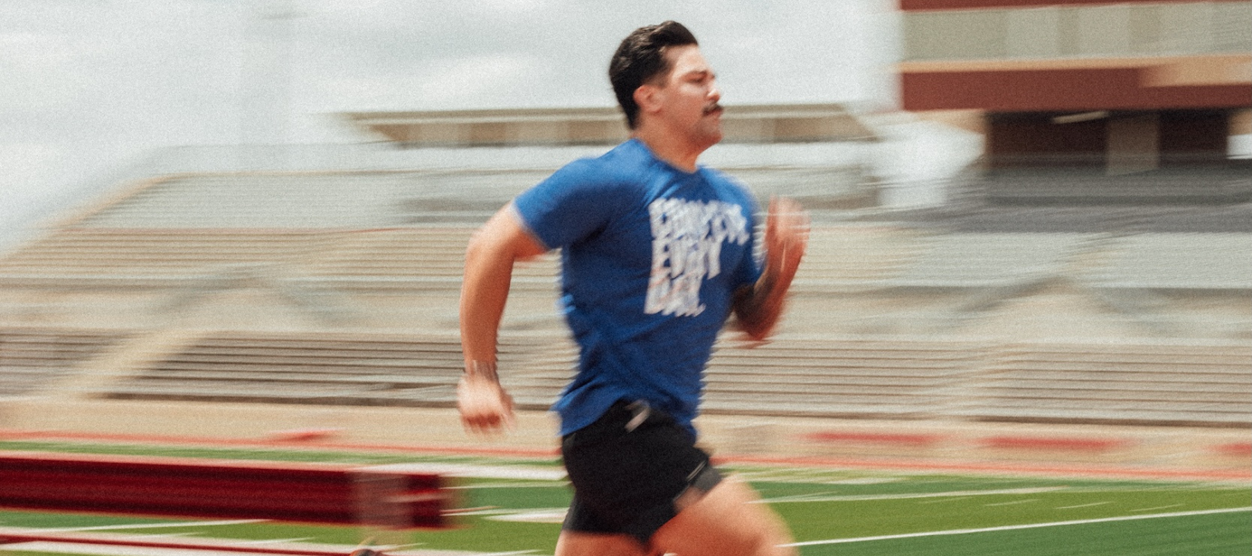 Athlete running wearing Compete Every Day