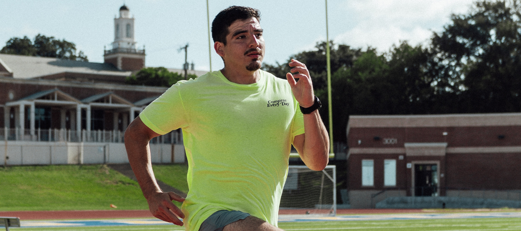 Athlete wearing Every Day is a Great Day to Compete yellow shirt
