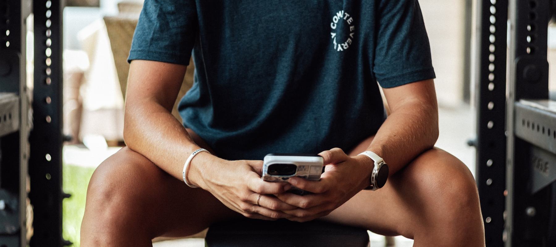 Never Let the Hard Days Break You navy shirt worn by female model on phone