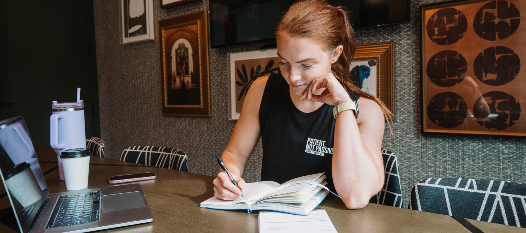 Woman using Compete Every Day Daily Journal