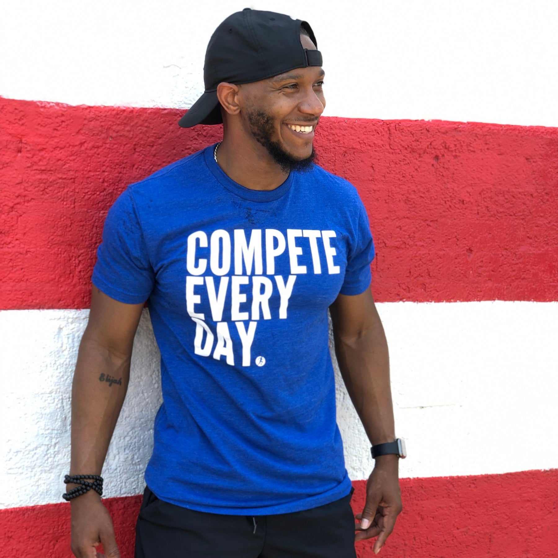 Athlete wearing blue Compete Every Day shirt