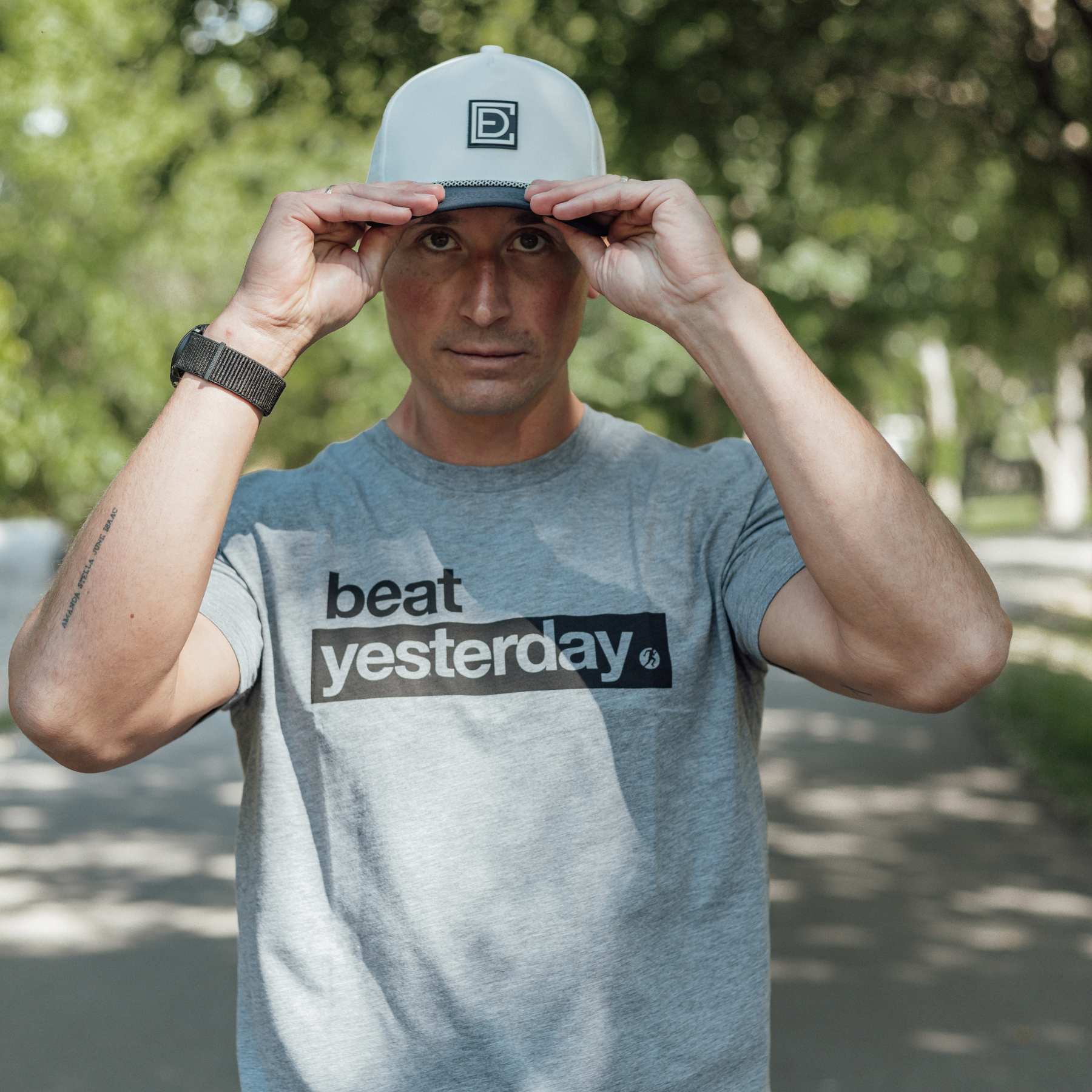 Man wearing grey Beat Yesterday Shirt